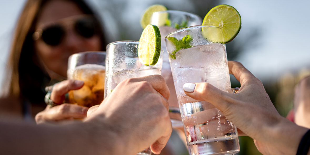 People drinking gin outside