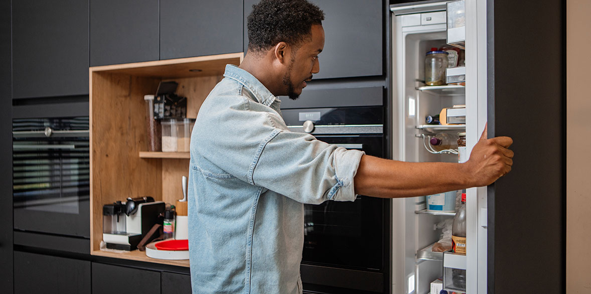 Looking inside fridge